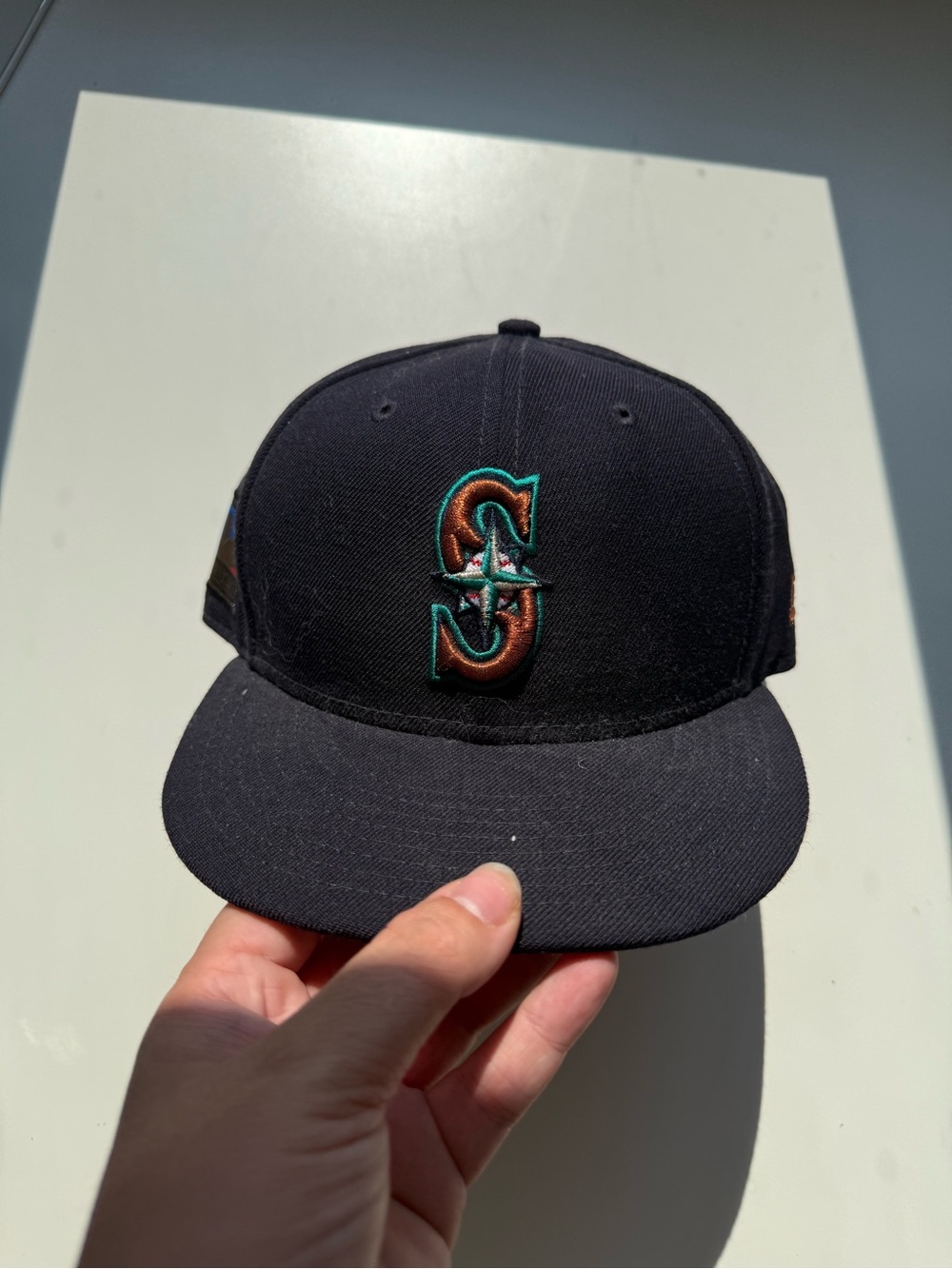 New Era Seattle Mariners Baseball Cap with Teal and Copper Logo